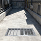 Heavy‑duty aluminum window well grate with expanded‑metal mesh and reinforced frame, designed for basement safety and ventilation.