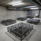 Powder‑coated steel window well grate with welded round‑bar grid and reinforced frame for basement safety and ventilation.