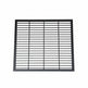 Black steel round‑bar window well grate installed beside a stone exterior wall with surrounding landscaping.