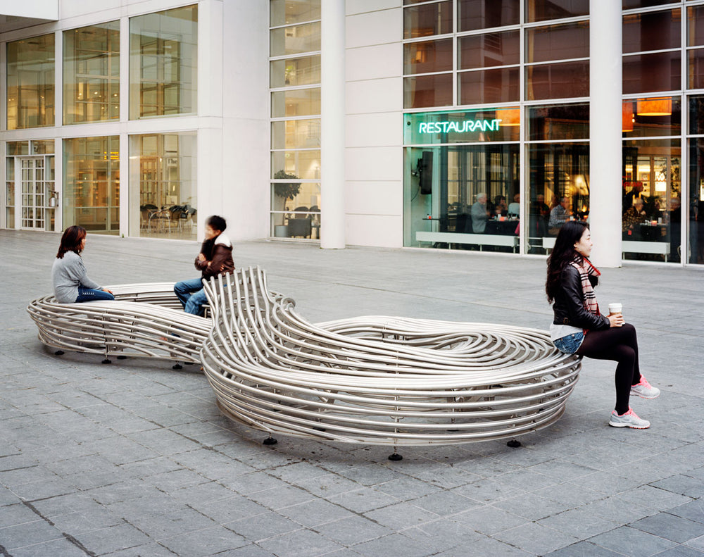 Waved Benchmark City Bench Formed From Rounded Stainless Steel Bars and Tubes | Model COLL1697