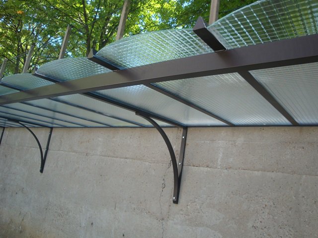 Steel Awnings with Foggy polycarbonate Plastic Cover - Custome Sizes and Shapes - Made in Canada - Model # WA892